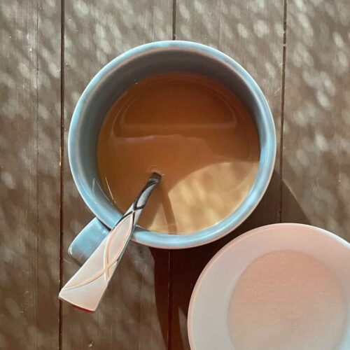 Cup of chai tea with sugar.