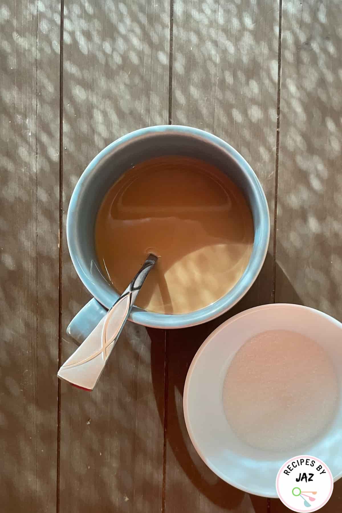 Cup of chai tea with sugar.