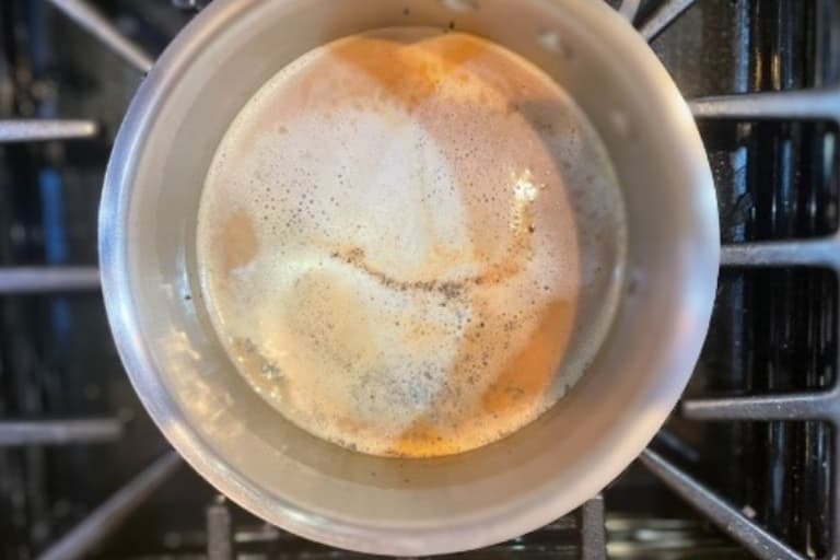 Simmering of chai tea on low heat.