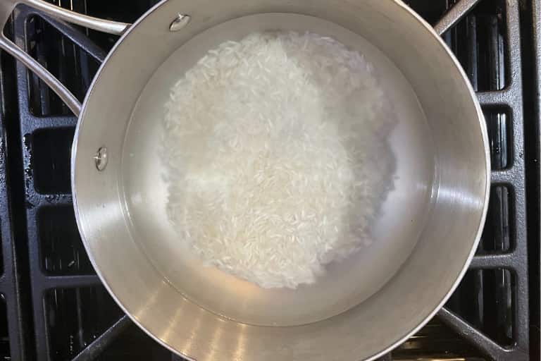 Rice added to boiling water.