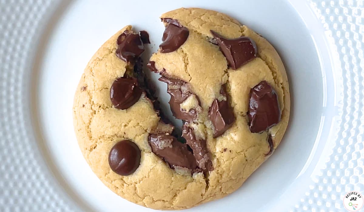 Chocolate chip cookie on a plate.